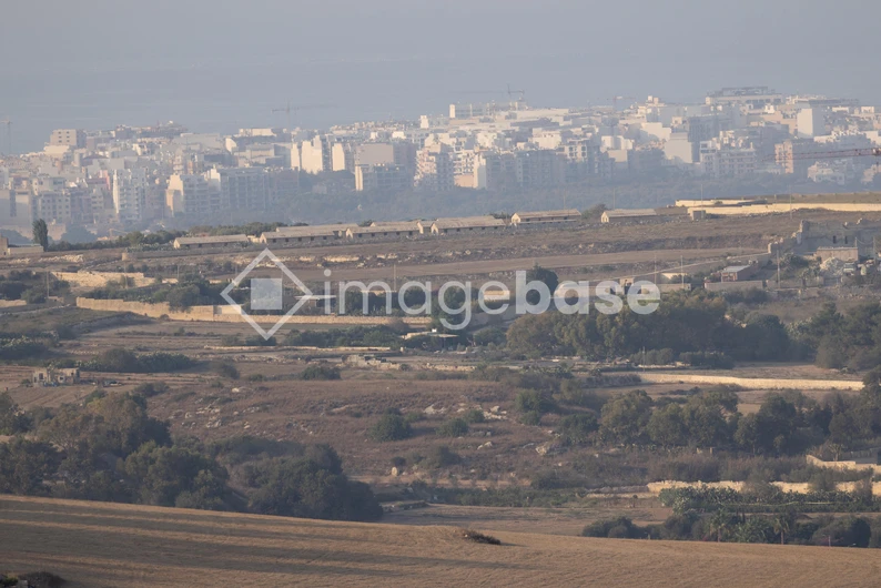 Rural Landscape with City Skyline