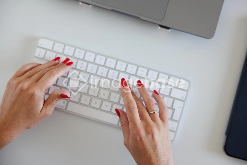 Hands Typing on Keyboard