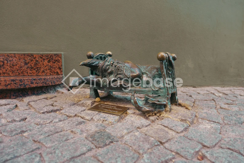 Bronze Sculpture on Cobblestone Path