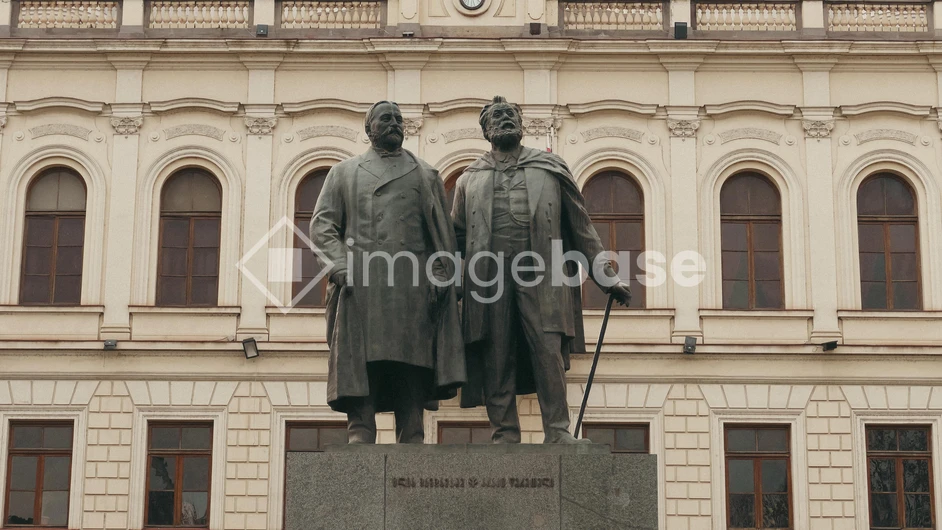Statue in Front of Historical Building