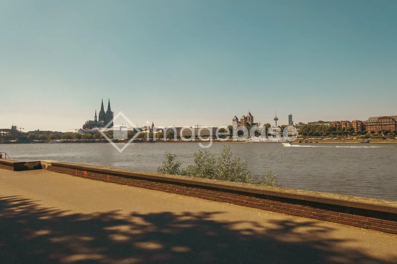 Riverbank View of a Historic Cathedral