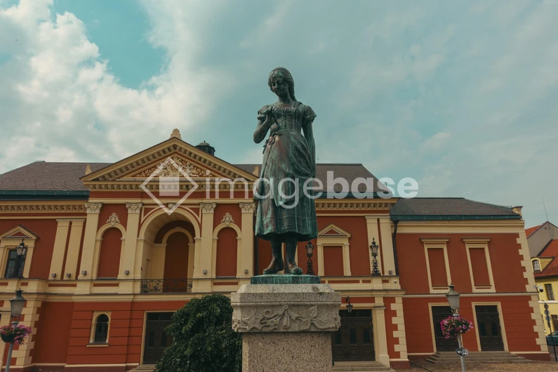 Historic Statue in Front of Classical Building