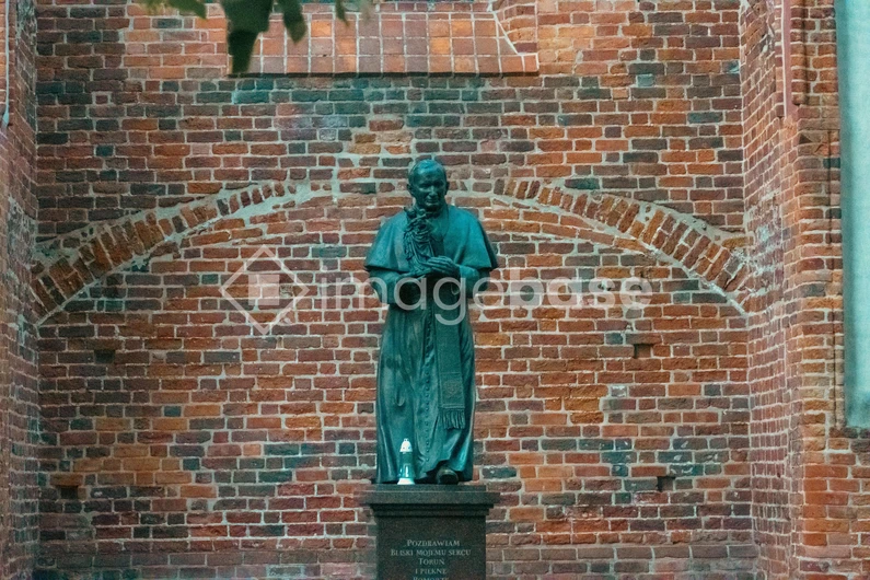 Historic Brick Wall and Statue