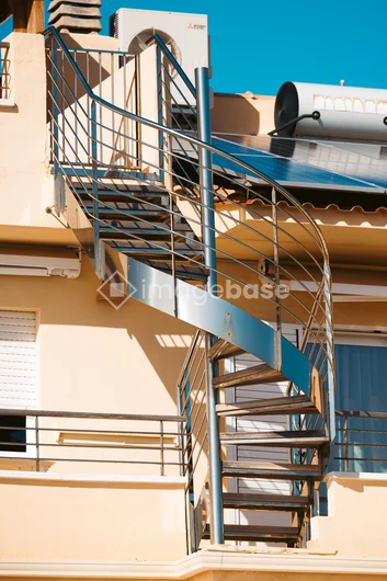 Spiral Staircase on Sunlit Building