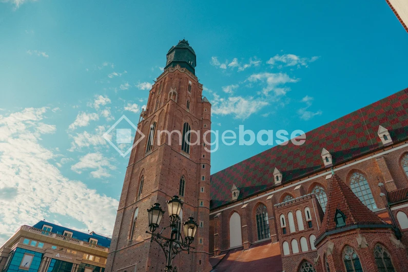 Historic Church Tower Under Blue Sky