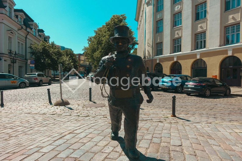 Statue on Cobblestone Street