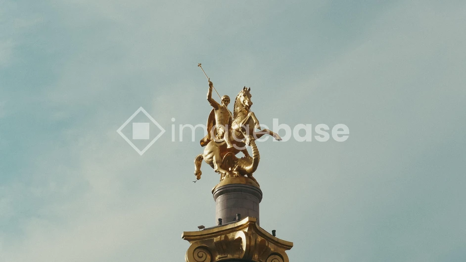 Golden Statue Against Sky