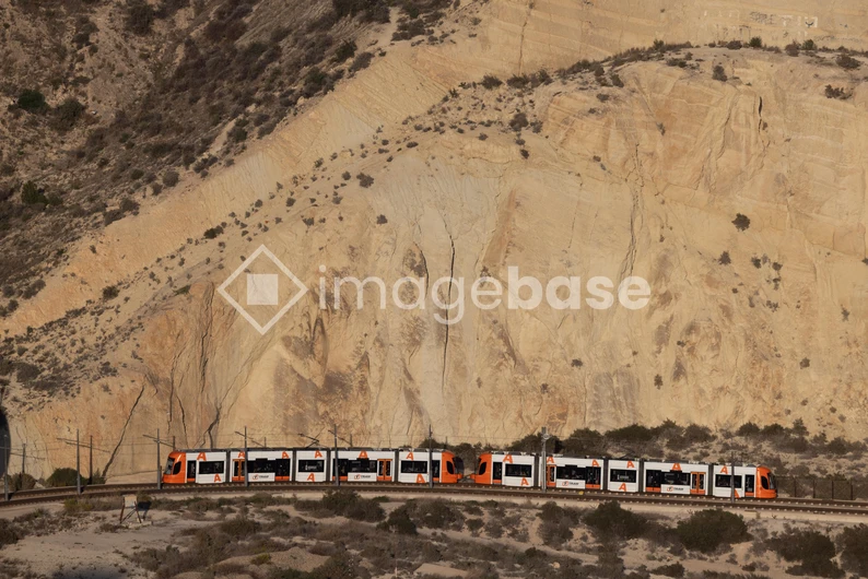 Train Passing Through Rocky Landscape