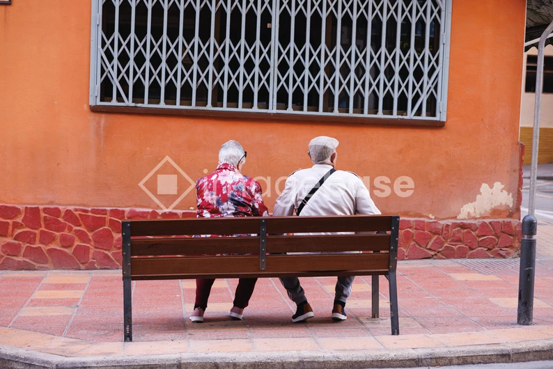 Elderly Couple on a Bench