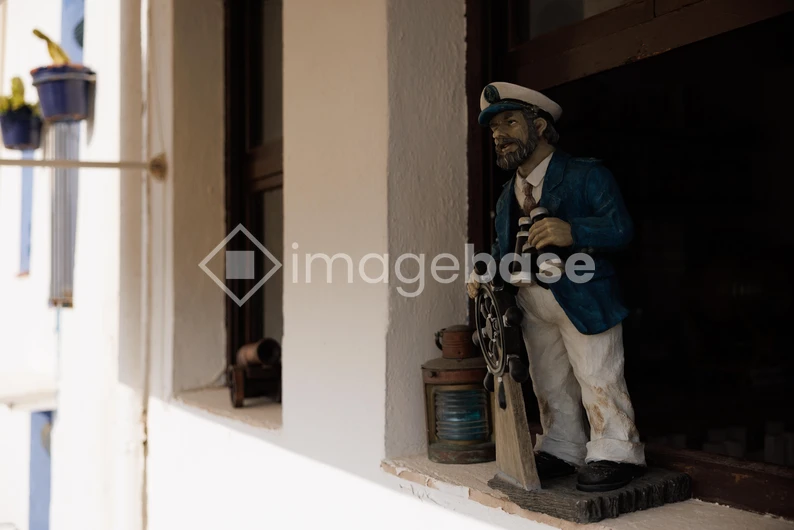 Coastal Decor with Sailor Sculpture