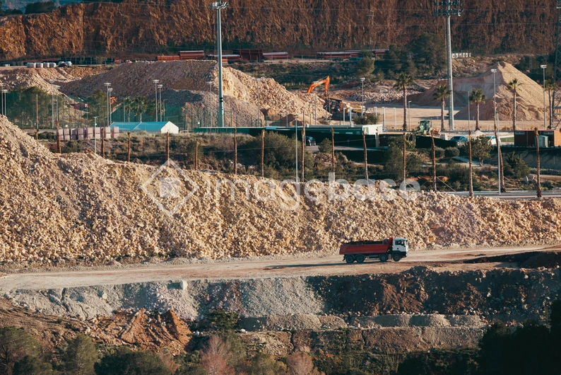 Quarry with Trucks and Machinery
