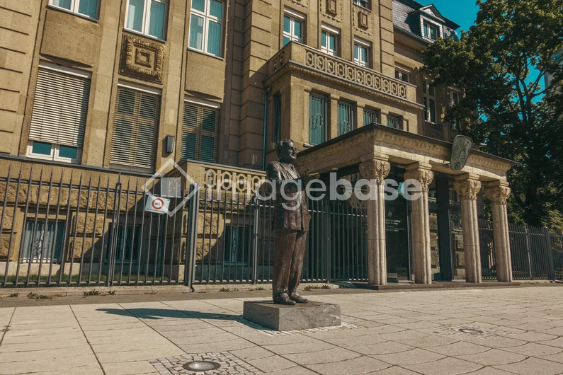 Statue in Front of Historical Building