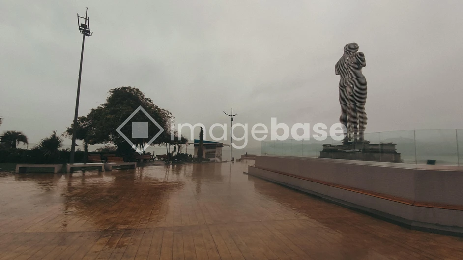 Rainy Promenade with Sculpture