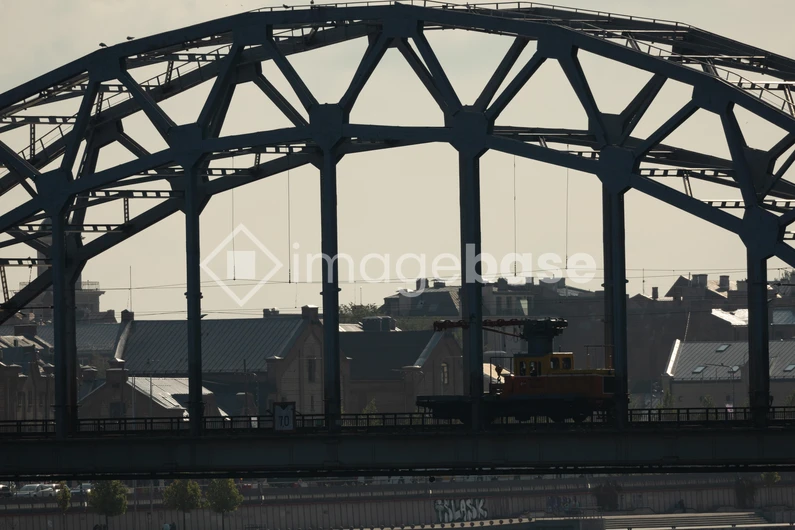 Silhouette of Train on Industrial Bridge