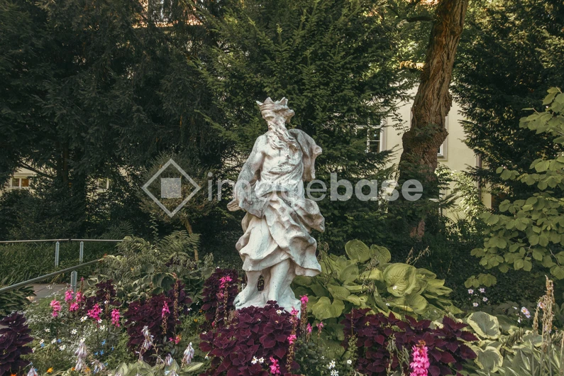 Garden Statue Amidst Lush Greenery