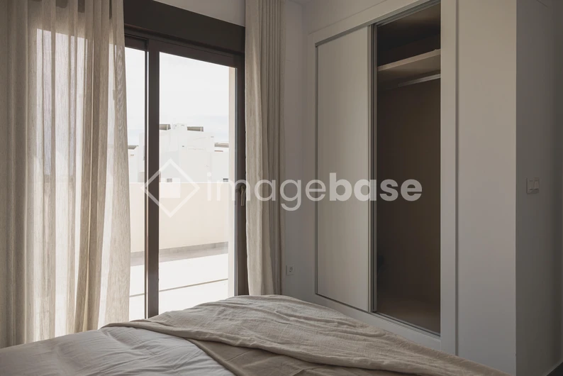 Minimalist Bedroom with Balcony View