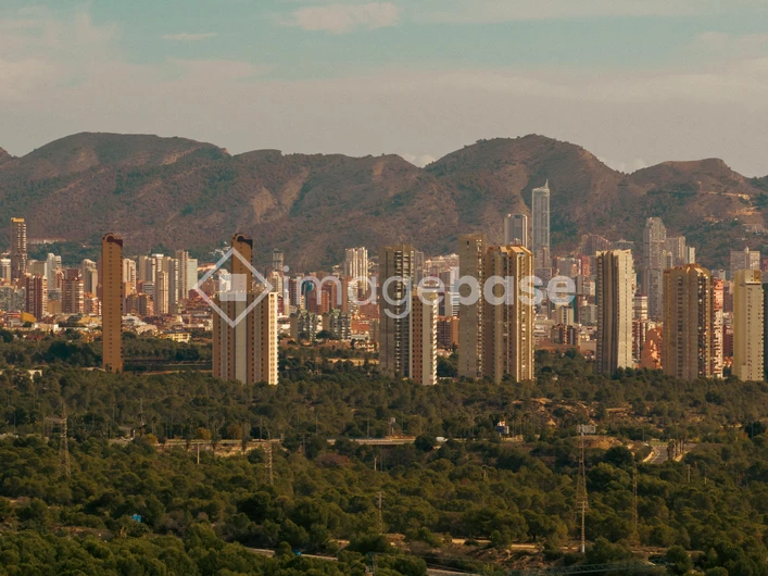 Cityscape with Mountain Backdrop