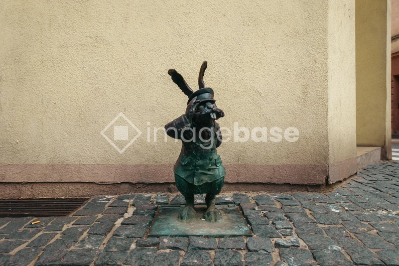 Quirky Statue on Cobbled Street