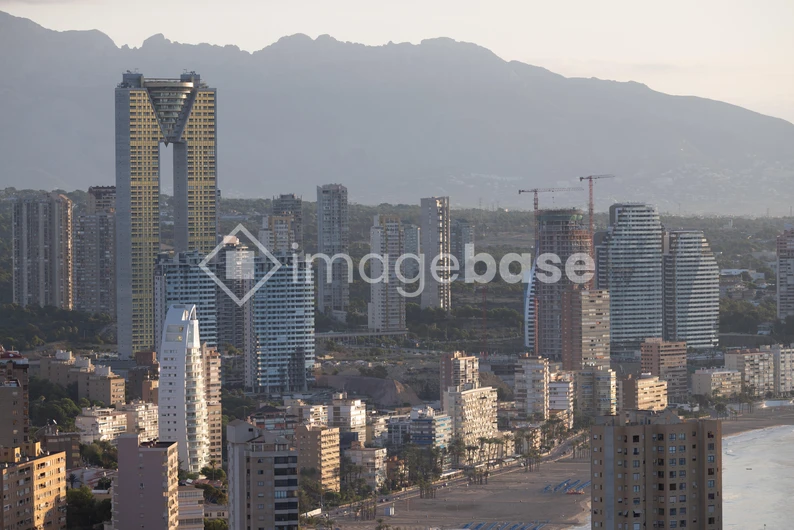 Cityscape with Mountain Backdrop