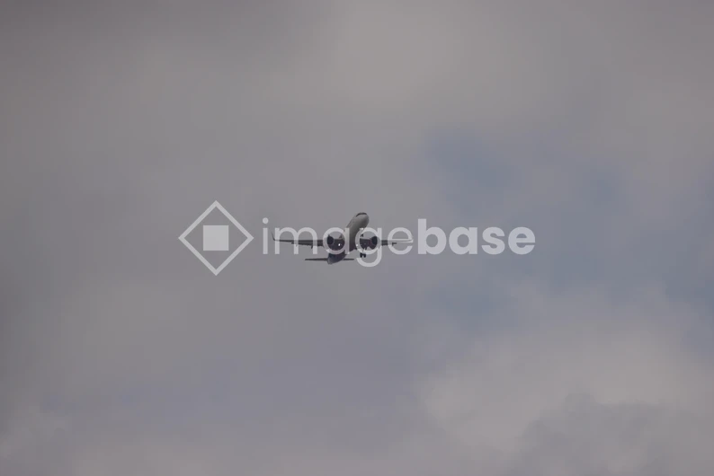 Airplane in the Cloudy Sky