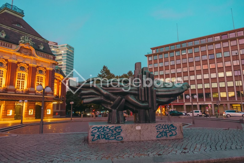 Urban Evening Scene with Sculpture