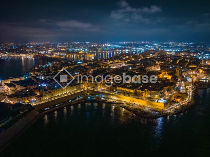 Illuminated Coastal City at Night