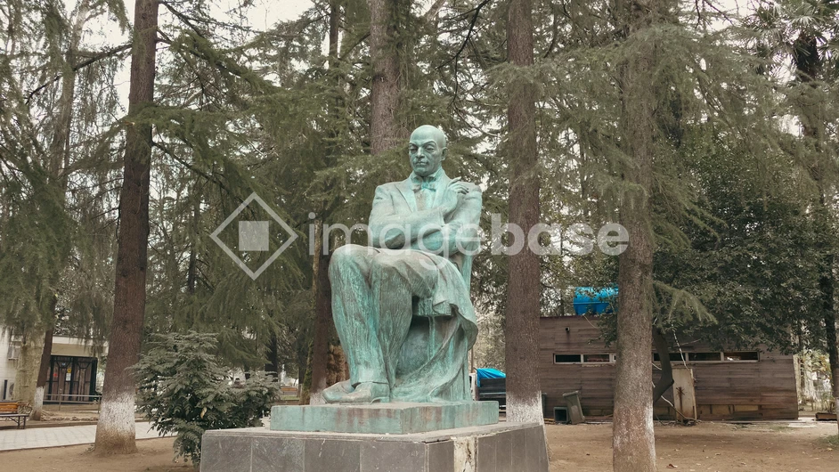 Bronze Statue in Forested Park