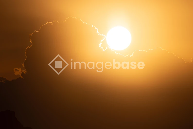 Sunset Behind Clouds