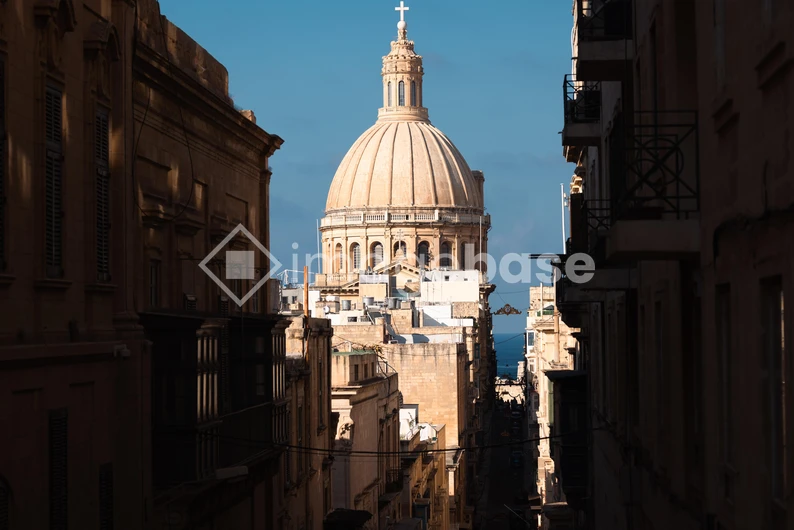 Grand Architectural Dome in Sunlit Alley