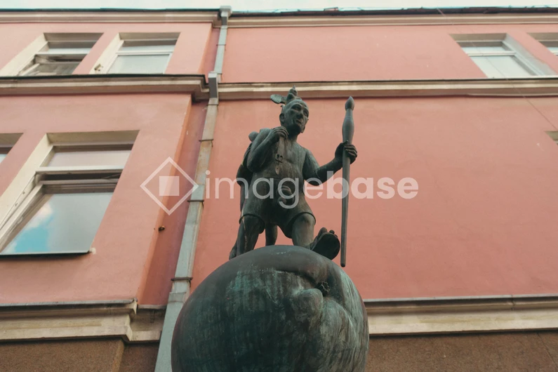 Statue Against Building Facade