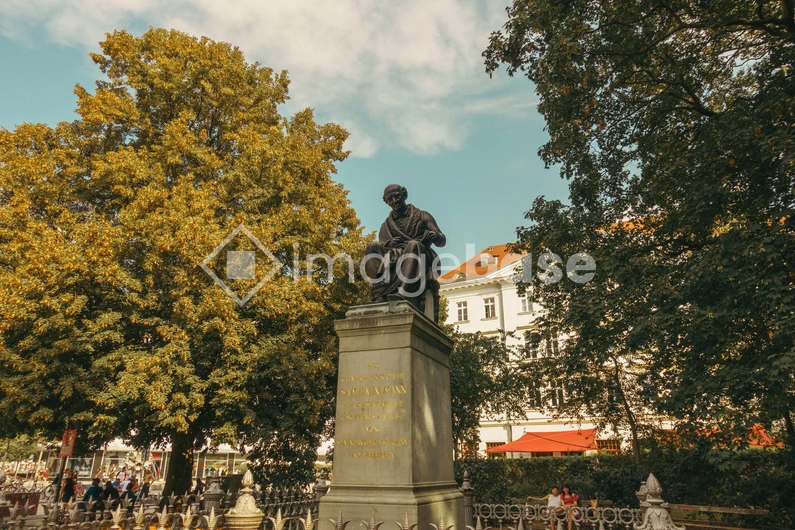 Statue in a Leafy Park
