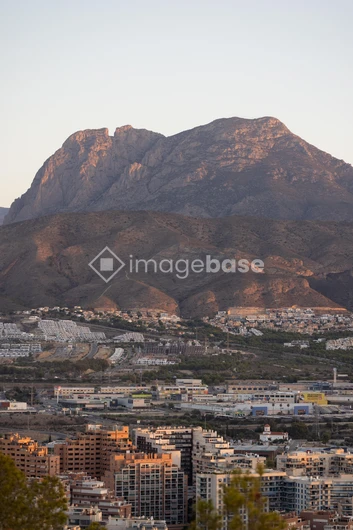 Cityscape with Mountain Backdrop