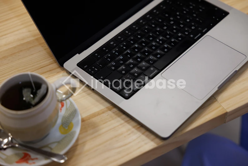 Work Setup with Laptop and Tea