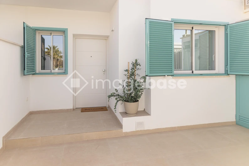 Modern Exterior with Turquoise Shutters