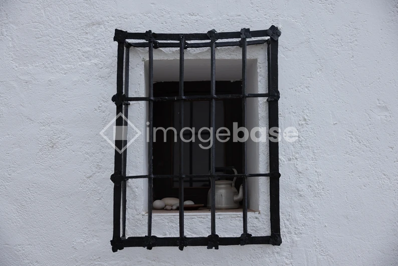 Rustic Window with Iron Bars