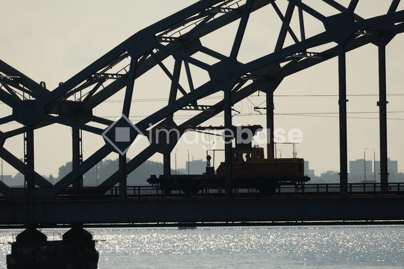 Silhouette of a Train on a Steel Bridge