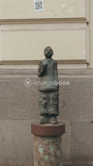 Bronze Sculpture Against Building