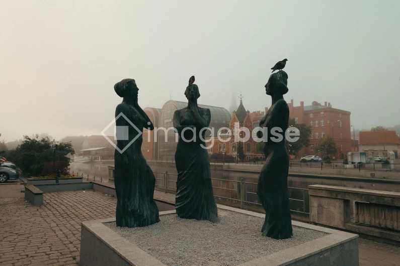 Statue Trio in Urban Setting
