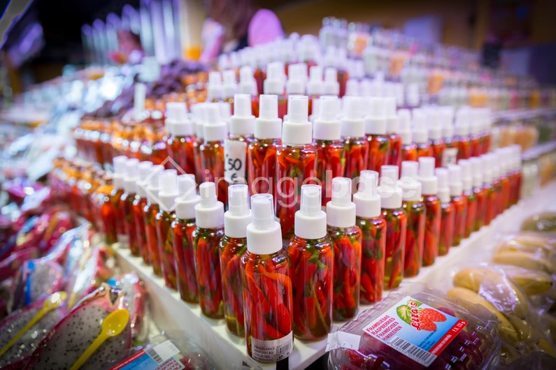 Market Display of Bottled Peppers