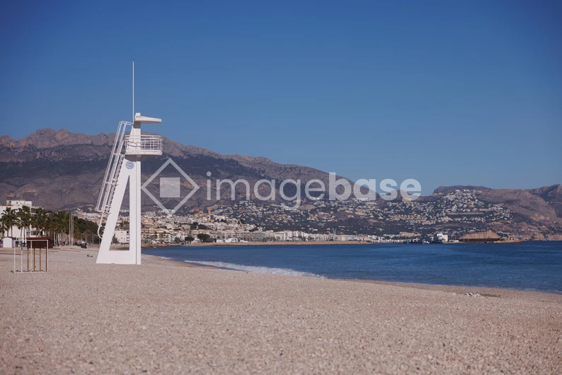 Tranquil Beach with Mountain Backdrop