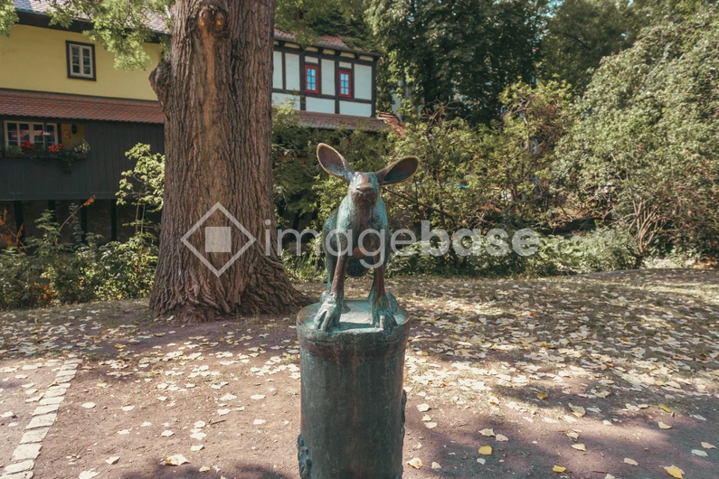 Statue in a Scenic Park