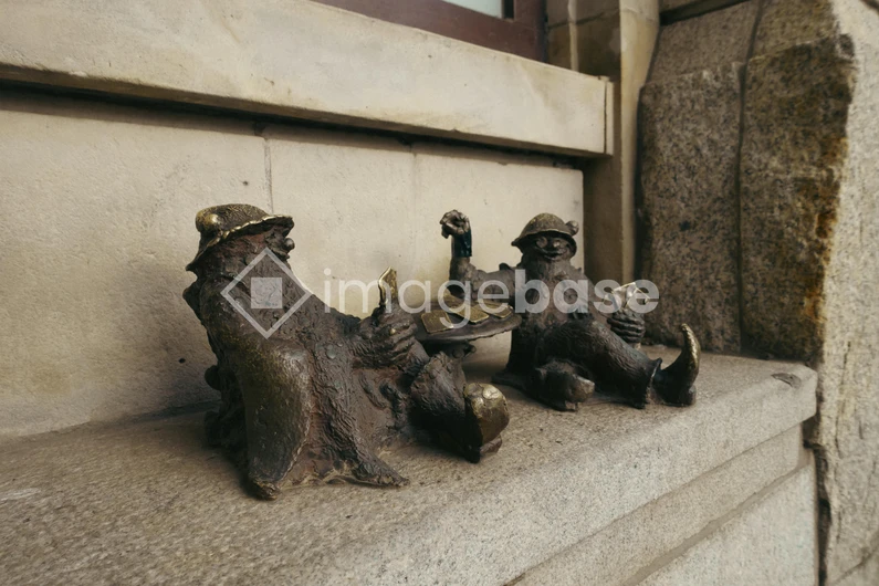 Bronze Sculptures on Stone Ledge