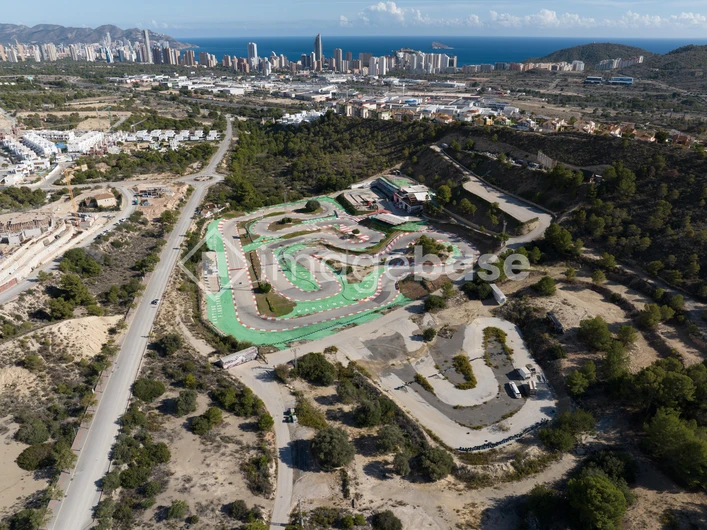 Aerial View of a Racing Track near Coastal City