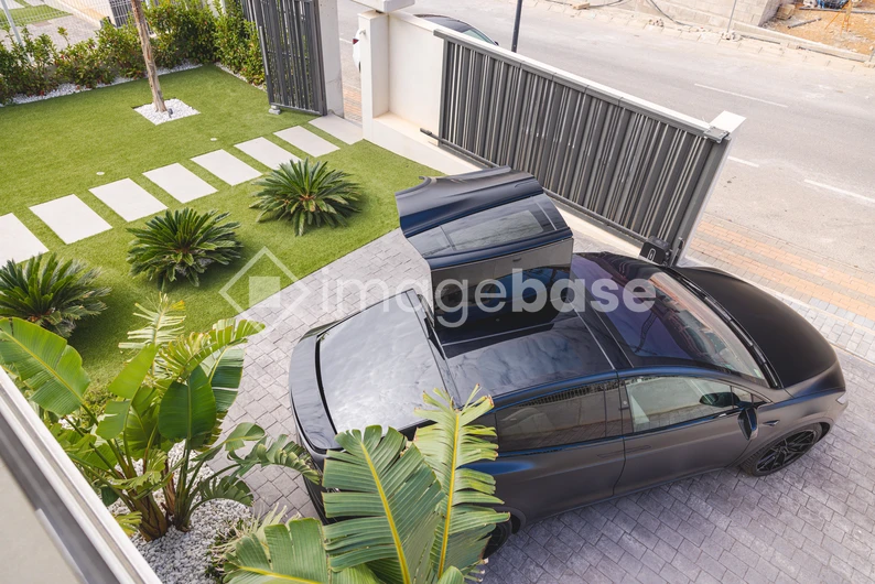 Modern Home with Electric Car