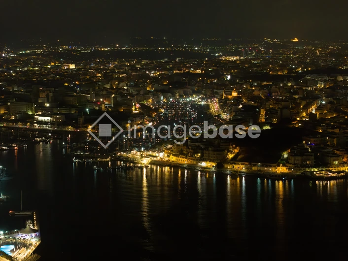Illuminated Coastal City at Night