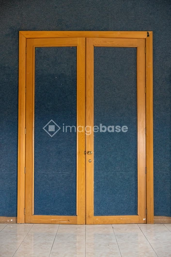 Wooden Door on Blue Wall