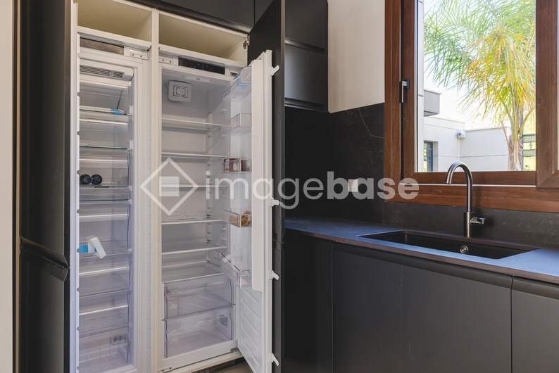 Modern Kitchen with Open Refrigerator