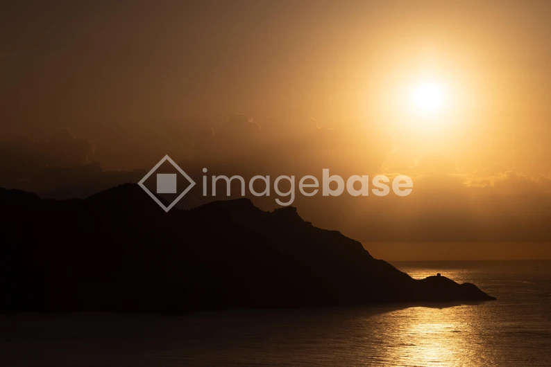 Sunset Over Ocean Horizon
