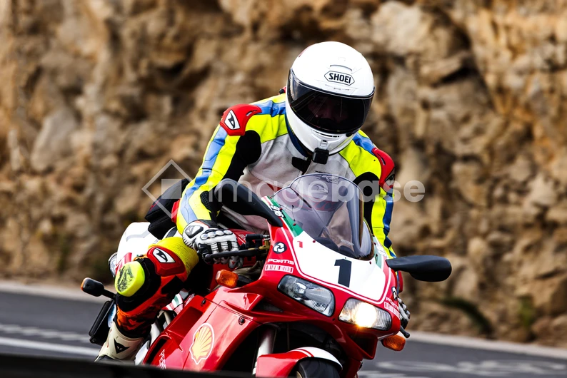 Motorcyclist on a Curvy Road