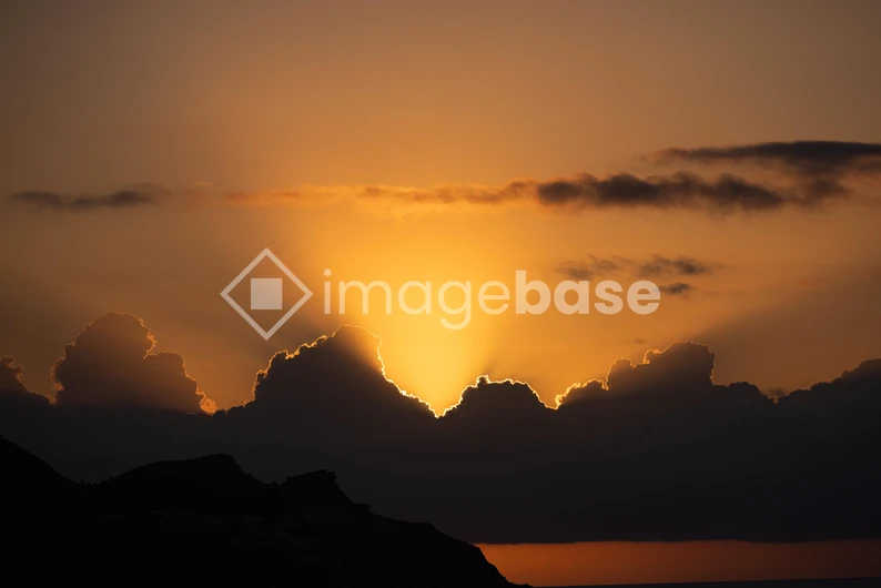 Sunset Behind Clouds